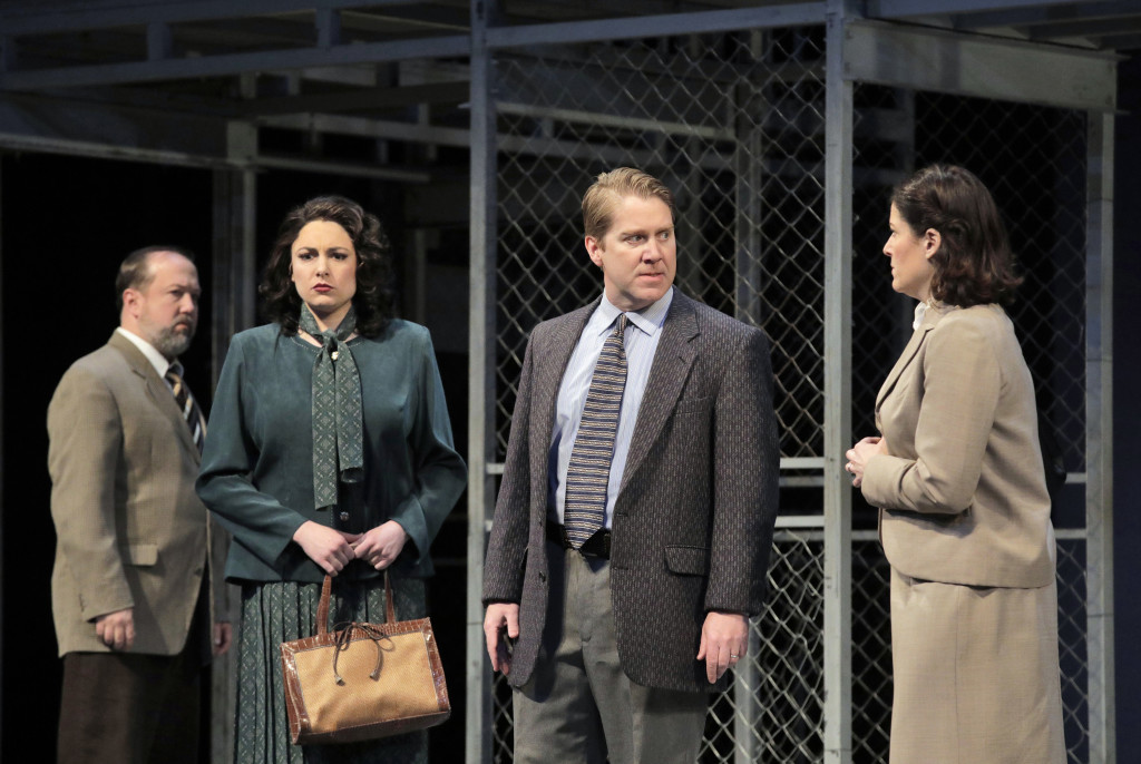 Brian Frutiger, April Martin and Daniel Belcher, in the roles of grieving parents of the murdered children, meet with Sister Helen (Kate Aldrich)